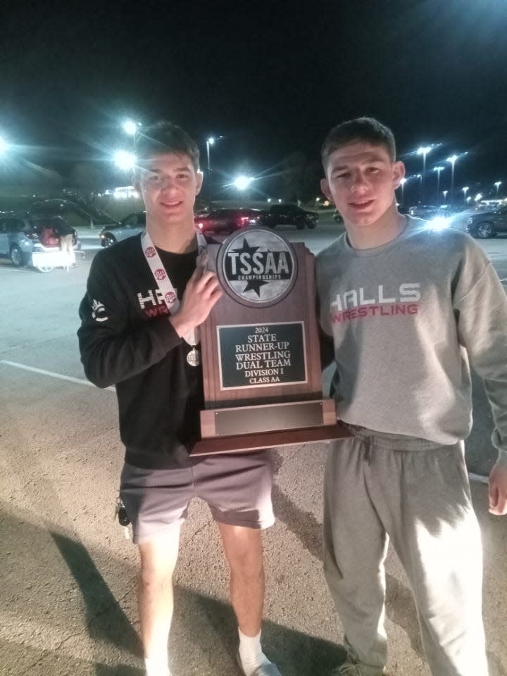 The Whaley brothers − Barrett (left) and Briar − share the Division I team state runnerup trophy.