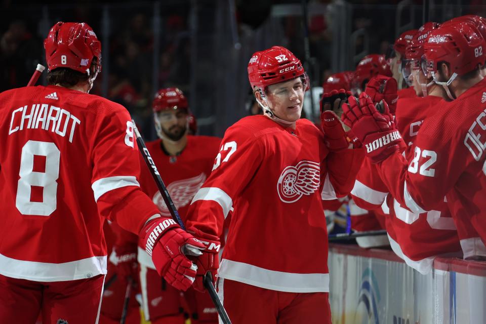 Jonatan Berggren of the Detroit Red Wings celebrates his first period goal with teammates while playing the Buffalo Sabres at Little Caesars Arena on November 30, 2022 in Detroit, Michigan.