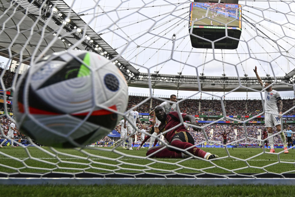 FILE - Belgium's Romelu Lukaku, front, scores a disallowed goal during the Group E match between Belgium and Slovakia at the Euro 2024 soccer tournament in Frankfurt, Germany, Monday, June 17, 2024. A high-tech soccer ball that helps with more accurate offside decisions will make its European Championship debut next year in Germany after being used at the 2022 World Cup. (Arne Dedert/dpa via AP, File)