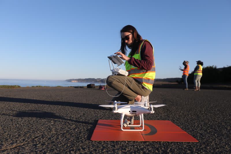 Nature Conservancy scientist Vienna Saccomanno prepares to launch a drone to survey kelp forest near Gualala, California