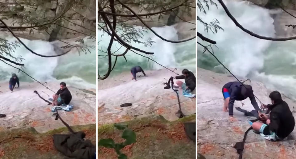 One of the men is seen feeding the makeshift rope to the stranded man. 