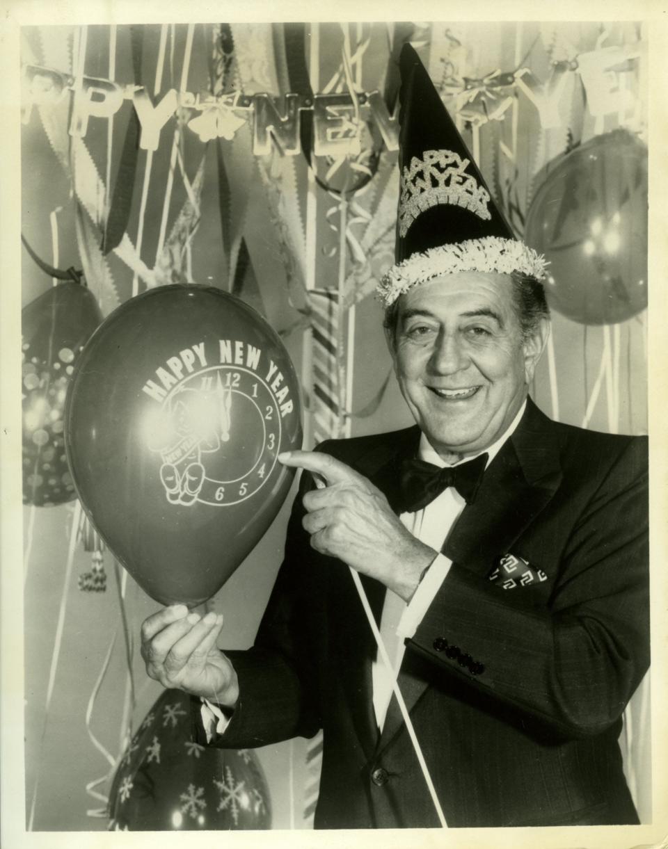 Guy Lombardo preparing for the New Year. This image was distributed as part of a promotion for the worldwide satellite telecast of his 1975 New Year’s Eve event.