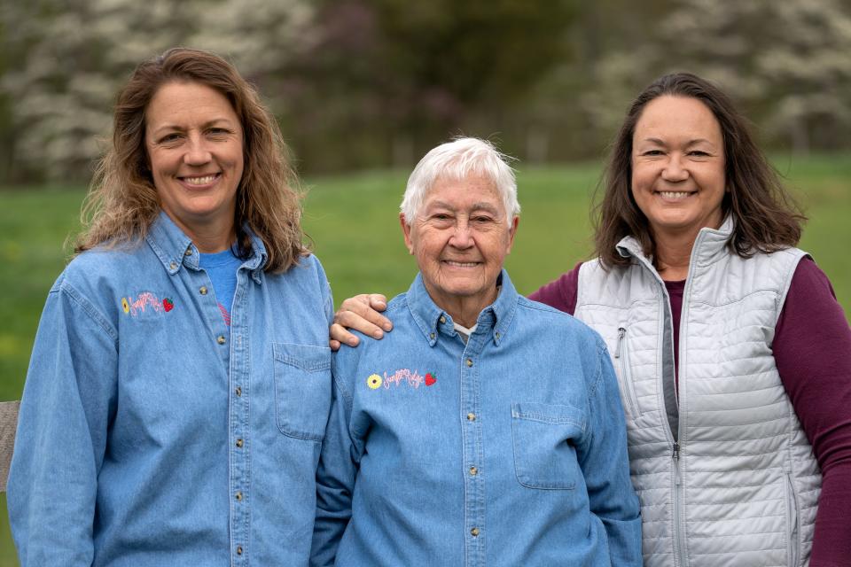 Sisters Rhonda Schafer, left, and Doris Scully, right, with their mother, Tresa Sips, at Schafer’s farm, Sunset Ridge Berries & Blooms, in Spencer.