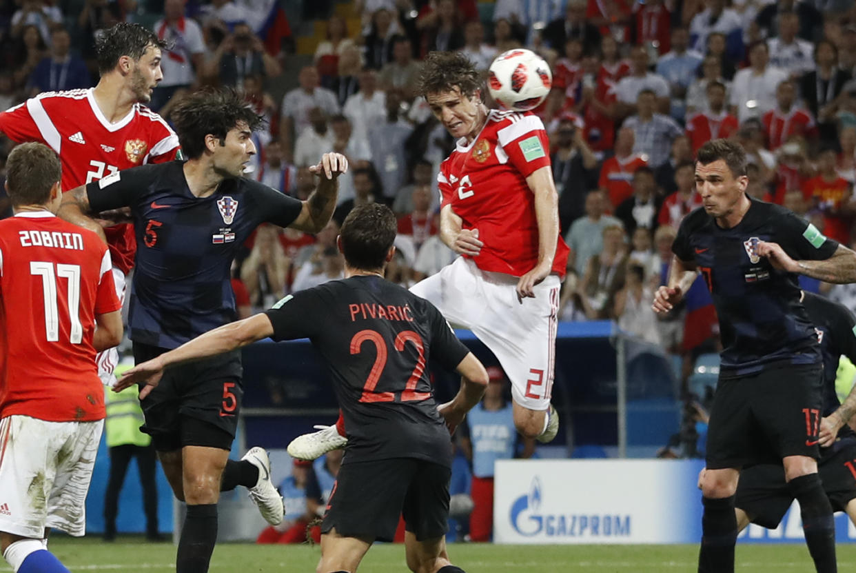 Russia’s Mario Fernandes , centre, scores his side’s second goal during the quarterfinal match between Russia and Croatia at the 2018 soccer World Cup in the Fisht Stadium, in Sochi, Russia, Saturday, July 7, 2018. (AP Photo/Darko Bandic)