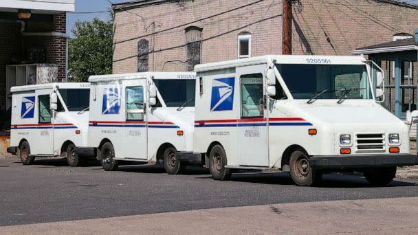 PHOTO: FILE - Three United States Postal Service (USPS) mail trucks are parked in front of the post office in Danville, Penn. (SOPA Images/LightRocket via Getty Images, FILE)