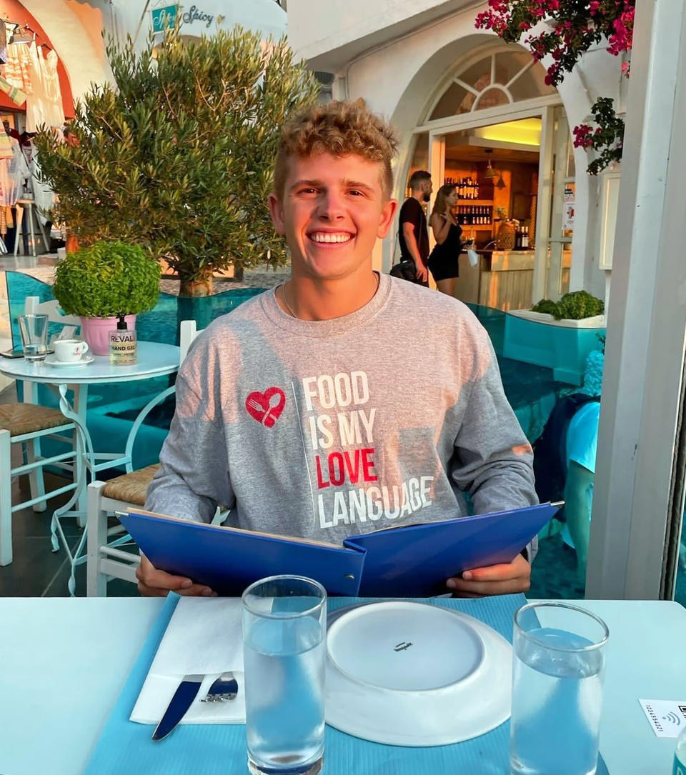 Winkler in Santorini, Greece eating dinner next to the water. (Courtesy Tommy Winkler)