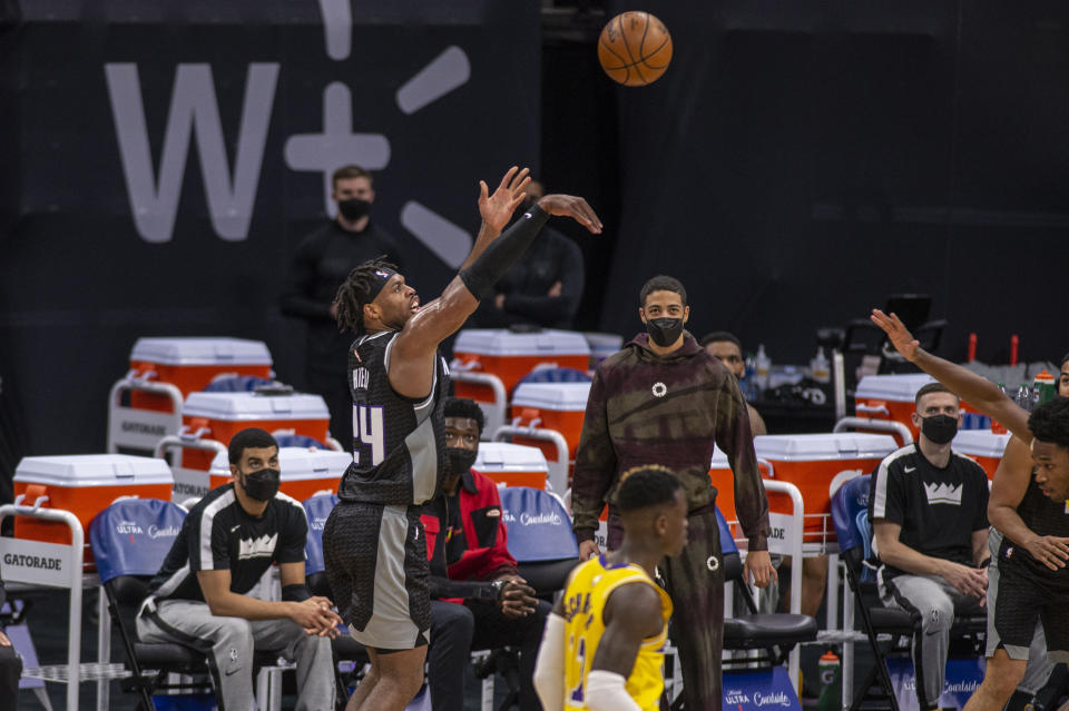 Sacramento Kings guard Buddy Hield (24) hits a three point basket against the Los Angeles Lakers in the second quarter of an NBA basketball game in Sacramento, Calif., Wednesday, March 3, 2021. (AP Photo/Hector Amezcua)