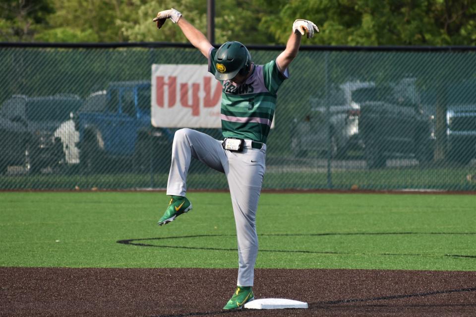 Rock Bridge's Payton Messer imitates the crane kick after reaching second on an error that scored two runs in the Bruins' 12-3 win over Blue Springs in the Class 6 District 5 semifinals on Tuesday.