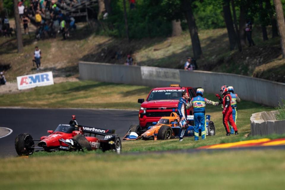 Will Power confronts Scott Dixon after the pair's crash during Saturday morning's IndyCar practice at Road America.