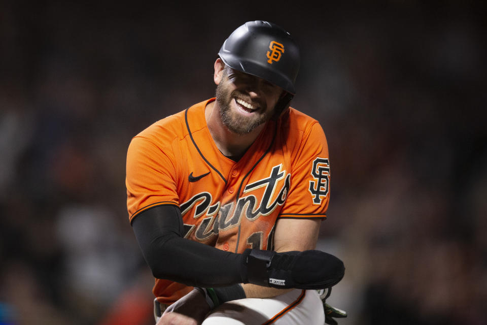 San Francisco Giants' Evan Longoria (10) reacts after scoring on a double by Luis González during the eighth inning of the team's baseball game against the Pittsburgh Pirates, Friday, Aug. 12, 2022, in San Francisco. (AP Photo/D. Ross Cameron)