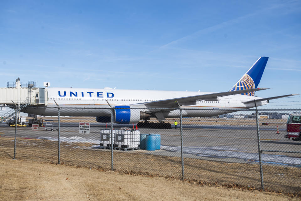 Emergency crews secure the site after a United airlines flight made an emergency landing at the Lincoln, Neb., airport on Saturday, Feb. 4, 2023. The flight headed from Chicago to Las Vegas made an unplanned stop in Nebraska on Saturday after the pilot reported engine problems. (Kenneth Ferriera/Lincoln Journal Star via AP)