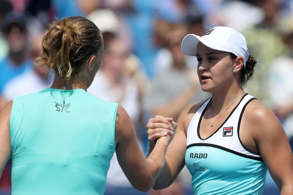 Ashleigh Barty of Australia (R) shakes hands with Svetlana Kuznetsova of Russia after losing in straight sets. (Photo by Rob Carr/Getty Images)