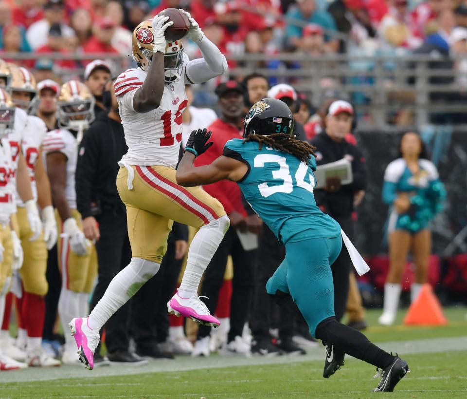 San Francisco 49ers wide receiver Deebo Samuel (19) pulls in a pass over the head of Jacksonville Jaguars cornerback Gregory Junior (34) during third quarter action. The Jacksonville Jaguars hosted the San Francisco 49ers at EverBank Stadium in Jacksonville, FL Sunday, November 12, 2023. The Jaguars trailed 13 to 3 at the half and fell to the 49ers with a final score of 34 to 3. [Bob Self/Florida Times-Union]