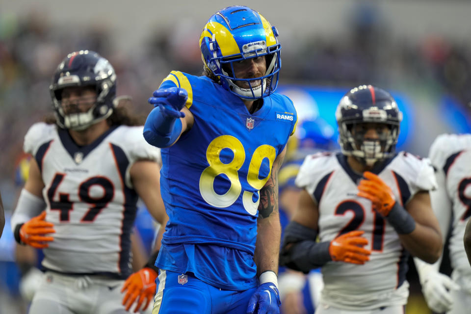 Los Angeles Rams tight end Tyler Higbee celebrates after scoring past Denver Broncos cornerback Damarri Mathis during the first half of an NFL football game between the Los Angeles Rams and the Denver Broncos on Sunday, Dec. 25, 2022, in Inglewood, Calif. (AP Photo/Jae C. Hong)