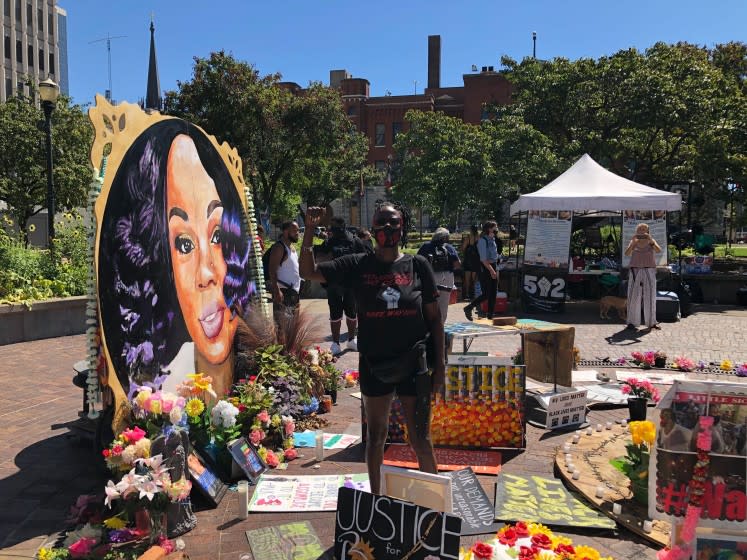Rosie Henderson, 47, of Louisville said she doesn't approve of militias attending protests or coming to the memorial to Breonna Taylor in downtown Louisville. "This is a loving place, a healing place, so keep that gun-toting away," she said.