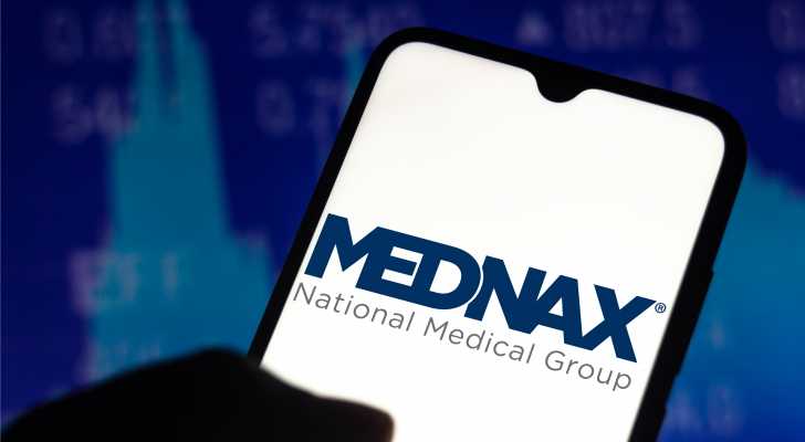 Mednax logo on a phone screen. MD stock.