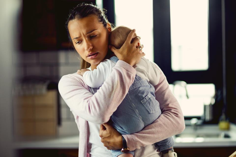 mom holding a baby