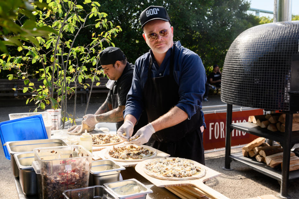 NEW YORK, NEW YORK - OCTOBER 12: Chef Anthony Carron prepares pizza at The Ultimate Pizza Party presented by Saputo hosted by Jeff Mauro during Food Network & Cooking Channel New York City Wine & Food Festival presented by Capital One at Fornino At Pier 6 on October 12, 2019 in New York City. (Photo by Mike Pont/Getty Images for NYCWFF)