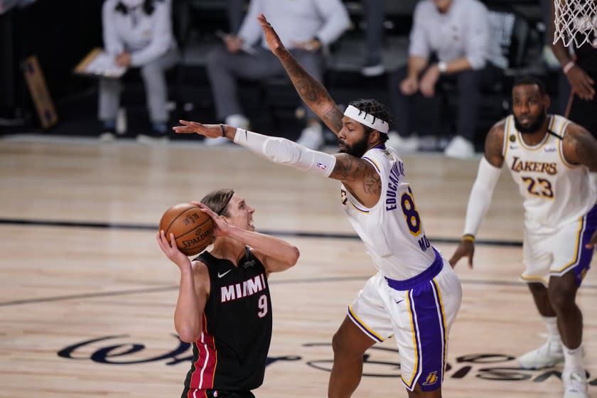 Los Angeles Lakers' Markieff Morris (88) attempt to block Miami Heat's Kelly Olynyk (9) during the second half in Game 3 of basketball's NBA Finals, Sunday, Oct. 4, 2020, in Lake Buena Vista, Fla. (AP Photo/Mark J. Terrill)