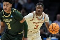 Texas guard Max Abmas (3) moves the ball against Colorado State during the first half of a first-round college basketball game in that NCAA Tournament, Thursday, March 21, 2024, in Charlotte, N.C. (AP Photo/Mike Stewart)