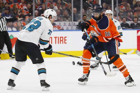 Feb 9, 2019; Edmonton, Alberta, CAN; San Jose Sharks defensemen Tim Heed (72) and Edmonton Oilers forward Jujhar Khaira (16) battle for a loose puck during the third period at Rogers Place. Mandatory Credit: Perry Nelson-USA TODAY Sports