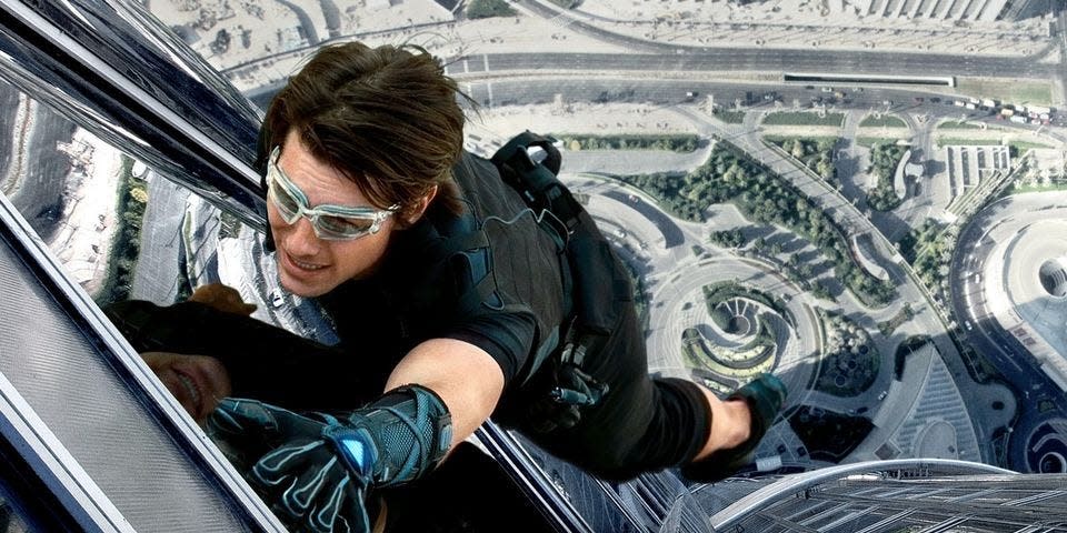 Tom Cruise in "Mission: Impossible — Ghost Protocol" scaling a building