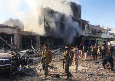 Smoke rises after a car bomb exploded in Iraqi border town of al-Qaim, Iraq January 11, 2019. REUTERS/Stringer.