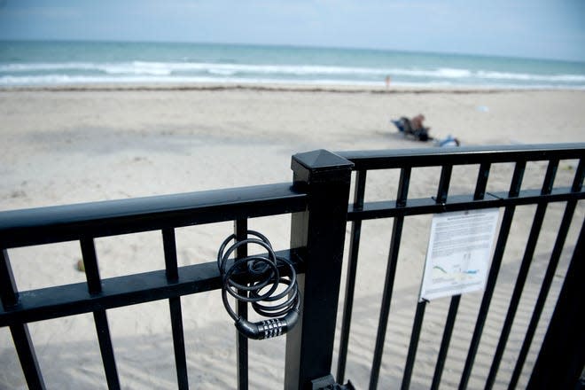 The beach access gate at Dunbar Road in Palm Beach is locked at night. The beach is closed sunset to sunrise. MEGHAN MCCARTHY/PALM BEACH DAILY NEWS