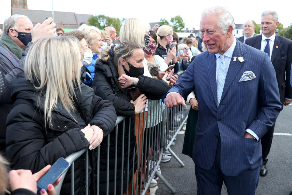 BANGOR, NORTHERN IRELAND - MAY 19: Prince Charles, Prince of Wales meets wellwishers as he visits Bangor open air market with Camilla, Duchess of Cornwall on May 19, 2021 in Bangor, Northern Ireland. (Photo by Chris Jackson - Pool/Getty Images)