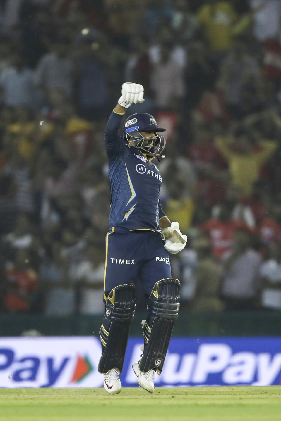 Rahul Tewatia of Gujarat Titans celebrates after winning the Indian Premier League cricket match between Punjab Kings and Gujarat Titans in Mohali, India, Thursday, April 13, 2023. (AP Photo/ Surjeet Yadav)