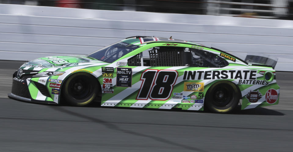 Kyle Busch (18) heads down the track during a NASCAR Cup Series auto race practice at New Hampshire Motor Speedway in Loudon, N.H., Friday, July 19, 2019. (AP Photo/Charles Krupa)