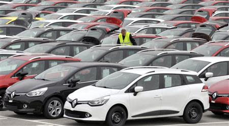 Renault cars produced in Turkey and awaiting export throughout Europe, are checked by a worker in the port of Koper October 14, 2013. REUTERS/Srdjan Zivulovic