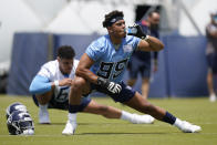 Tennessee Titans linebacker Rashad Weaver (99) stretches during NFL football rookie minicamp Saturday, May 15, 2021, in Nashville, Tenn. (AP Photo/Mark Humphrey, Pool)