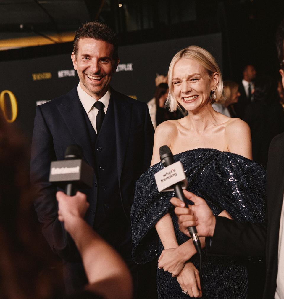 Bradley Cooper in a blue suit and Carey Mulligan in a blue dress at Netflix's "Maestro" LA special screening