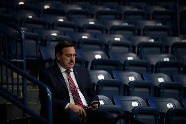 MyPillow CEO Mike Lindell checks his cellphone inside the Covelli Centre before a Save America Rally, featuring former President Donald Trump, to support Republican candidates running for state and federal offices on September 17, 2022 in Youngstown, Ohio.