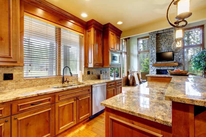 Luxury home in the mountains with wood kitchen and granite countertops.