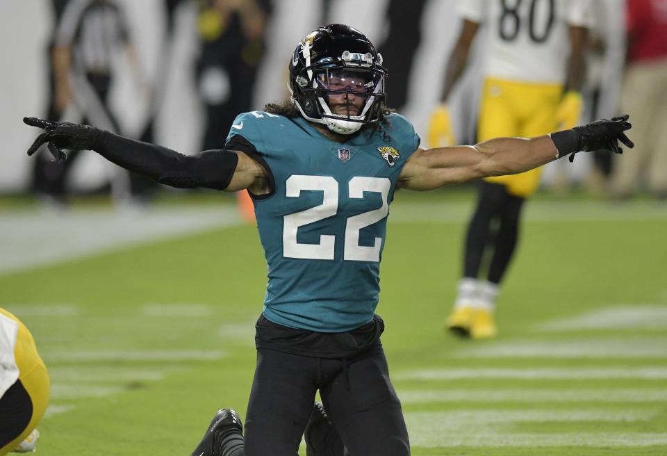 Jaguars cornerback Xavier Crawford signals incomplete on one of the two passes he broke up in the end zone during Saturday's preseason game against the Steelers.