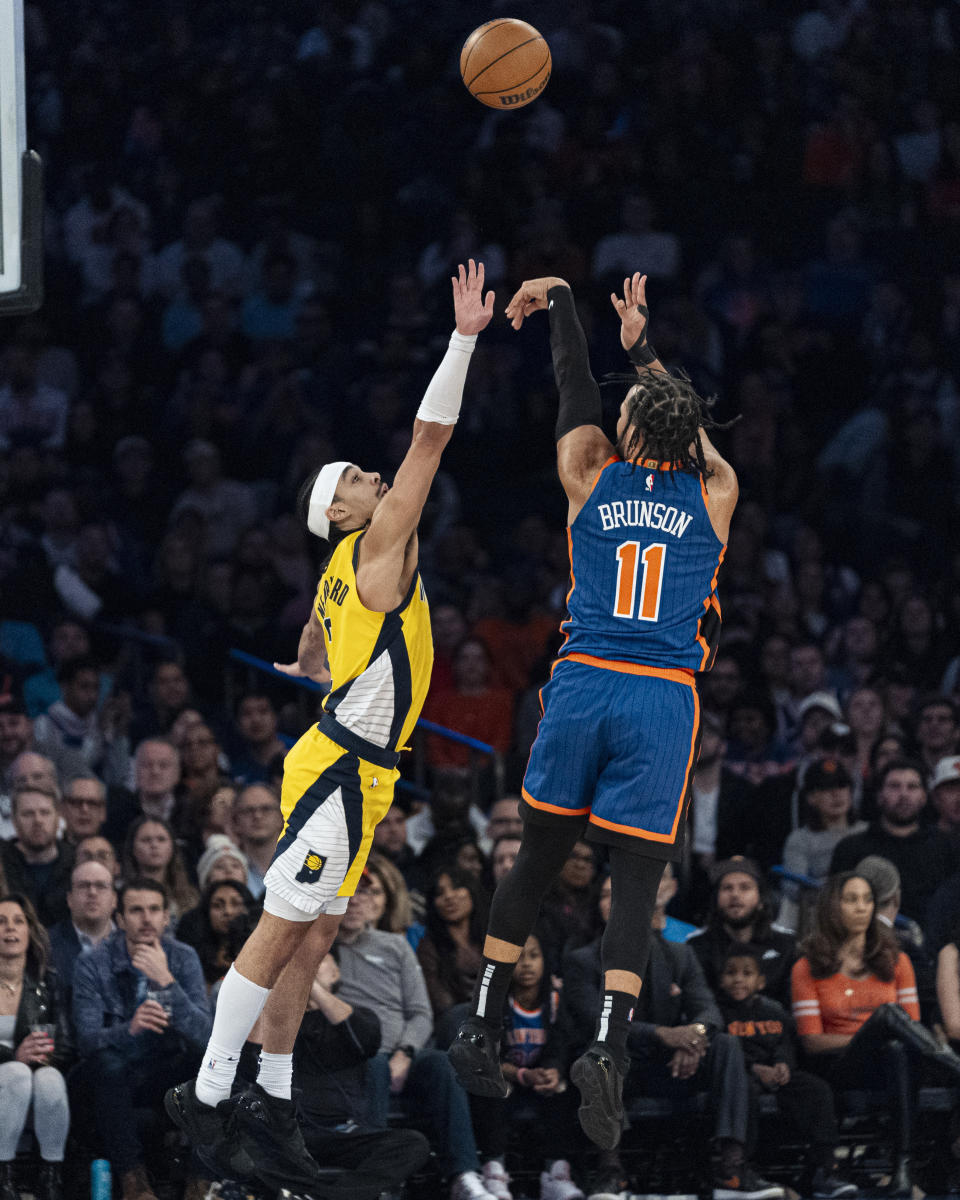 New York Knicks guard Jalen Brunson (11) shoots over Indiana Pacers guard Andrew Nembhard during the first half of an NBA basketball game in New York, Saturday, Feb. 10, 2024. (AP Photo/Peter K. Afriyie)