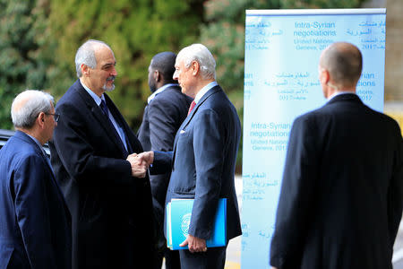 Syrian Ambassador to the U.N. Bashar al Jaafari (2nd L) is welcomed by U.N. mediator for Syria Staffan de Mistura (C) at the United Nations office in Geneva, Switzerland, February 24, 2017. REUTERS/Pierre Albouy