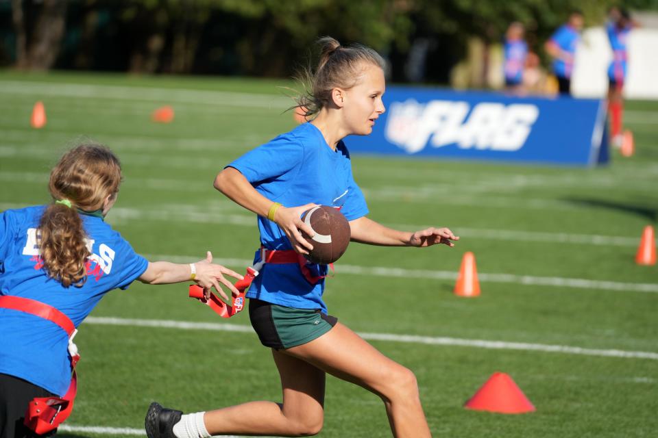 Girls play in a NFL Flag football event in Watford, England, on Oct. 6.