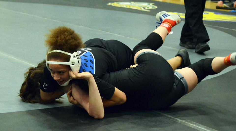 Boonsboro's Adriana Moss pins Winters Mill's Addie Vallandingham in the first period to win the girls 140-pound title at the 2A-1A West region championships.