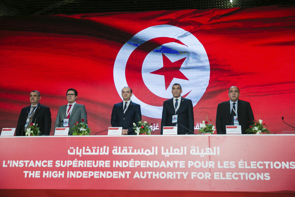 Independent High Authority for Elections announces the results of the constitutional referendum in Tunis, Tunisia, Tuesday, July 26, 2022. Tunisians have voted in favor of a new constitution that critics fear could entrench efforts by the president to consolidate power, according to official preliminary results late Tuesday. (AP Photo/Hassene Dridi)