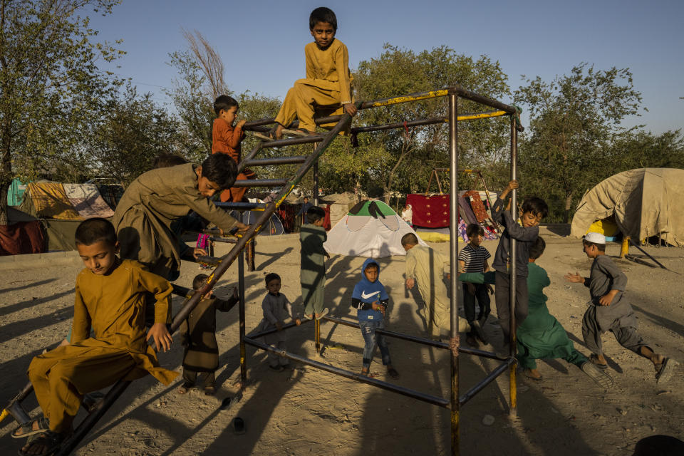 Afghan displaced children play at an internally displaced persons camp in Kabul, Afghanistan, Monday, Sept. 13, 2021. (AP Photo/Bernat Armangue)