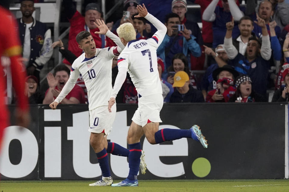 United States forward Christian Pulisic (10) and midfielder Gio Reyna (7) celebrate a goal against Ghana during the first half of an international friendly soccer match Tuesday, Oct. 17, 2023, in Nashville, Tenn. (AP Photo/George Walker IV)