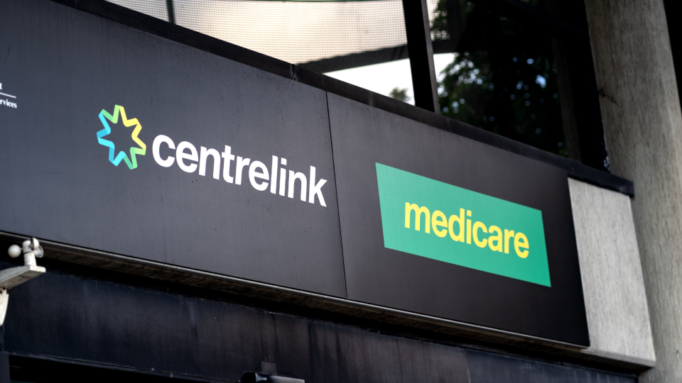 A sign on the exterior of the Centrelink and Medicare building.