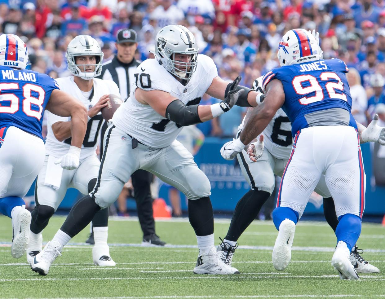 Sep 17, 2023; Orchard Park, New York, USA; Las Vegas Raiders guard Greg Van Roten (70) blocks Buffalo Bills defensive tackle DaQuan Jones (92) for quarterback Jimmy Garoppolo (10) in the second quarter at Highmark Stadium. Mandatory Credit: Mark Konezny-USA TODAY Sports