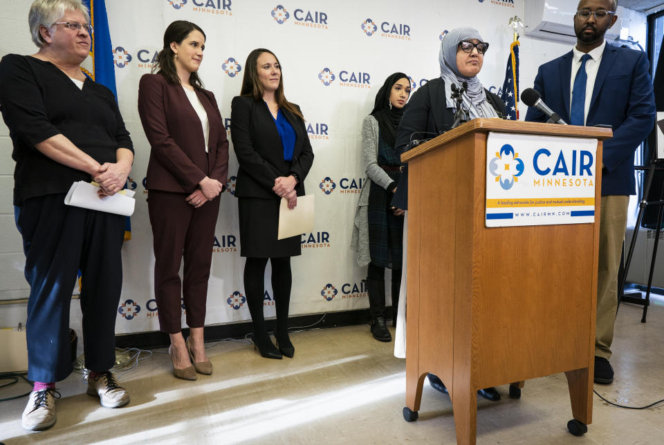 Aida Shyef Al-Kadi, of St. Louis Park, speaks during a press conference at CAIR-MN headquarters in Minneapolis on Tuesday, December 17, 2019. Al-Kadi reached a settlement with Ramsey County for $120,000 after claiming religious discrimination after being forced to remove her hijab for a booking photo and go without a hijab for a time while in jail. (Leila Navidi/Star Tribune via AP)