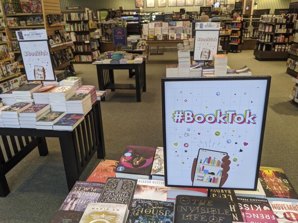 CORRECTS SPELLING TO BARNES & NOBLE NOT BARNS AND NOBLE A table displays signs with #BookTok, at a Barnes & Noble in Scottsdale, Ariz., Thursday, Sept. 2, 2021. TikTok, an app best known for dancing videos with 1 billion users worldwide, has also become a shopping phenomenon. National chains are setting up TikTok sections. (AP Photo/Tali Arbel)