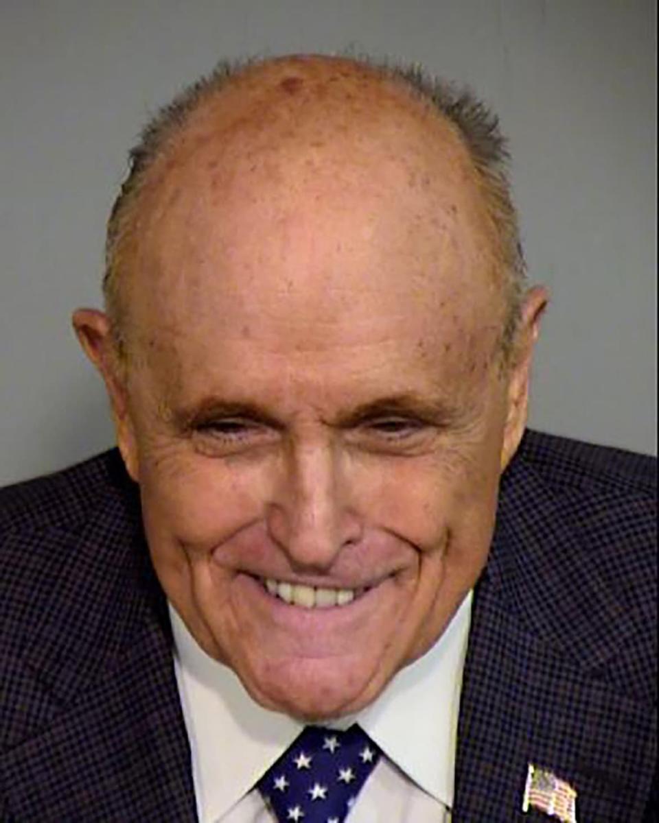 Rudy Giuliani poses for a Maricopa County Sheriff's Office booking photograph. 