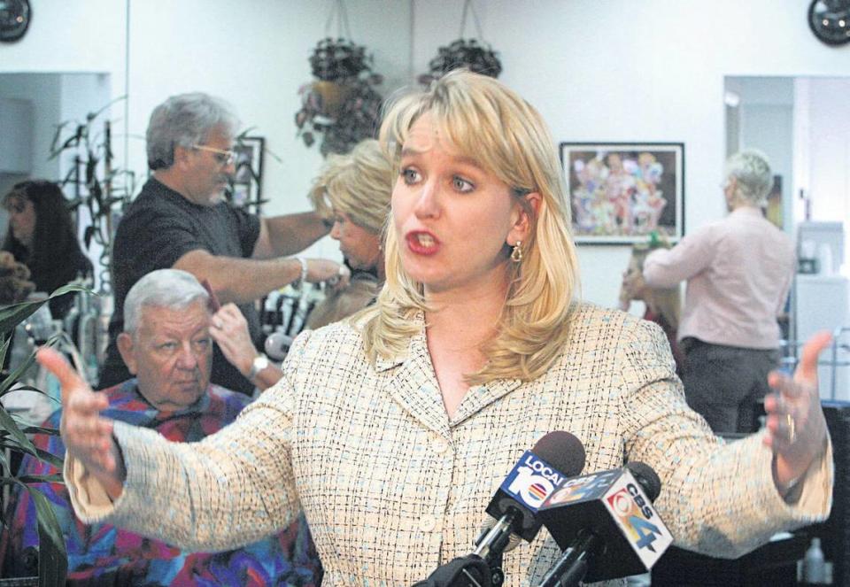 Tiffany Carr — shown during a 2004 visit to a Hollywood nail salon where she spoke on domestic violence — was the longtime CEO of the Florida Coalition Against Domestic Violence.